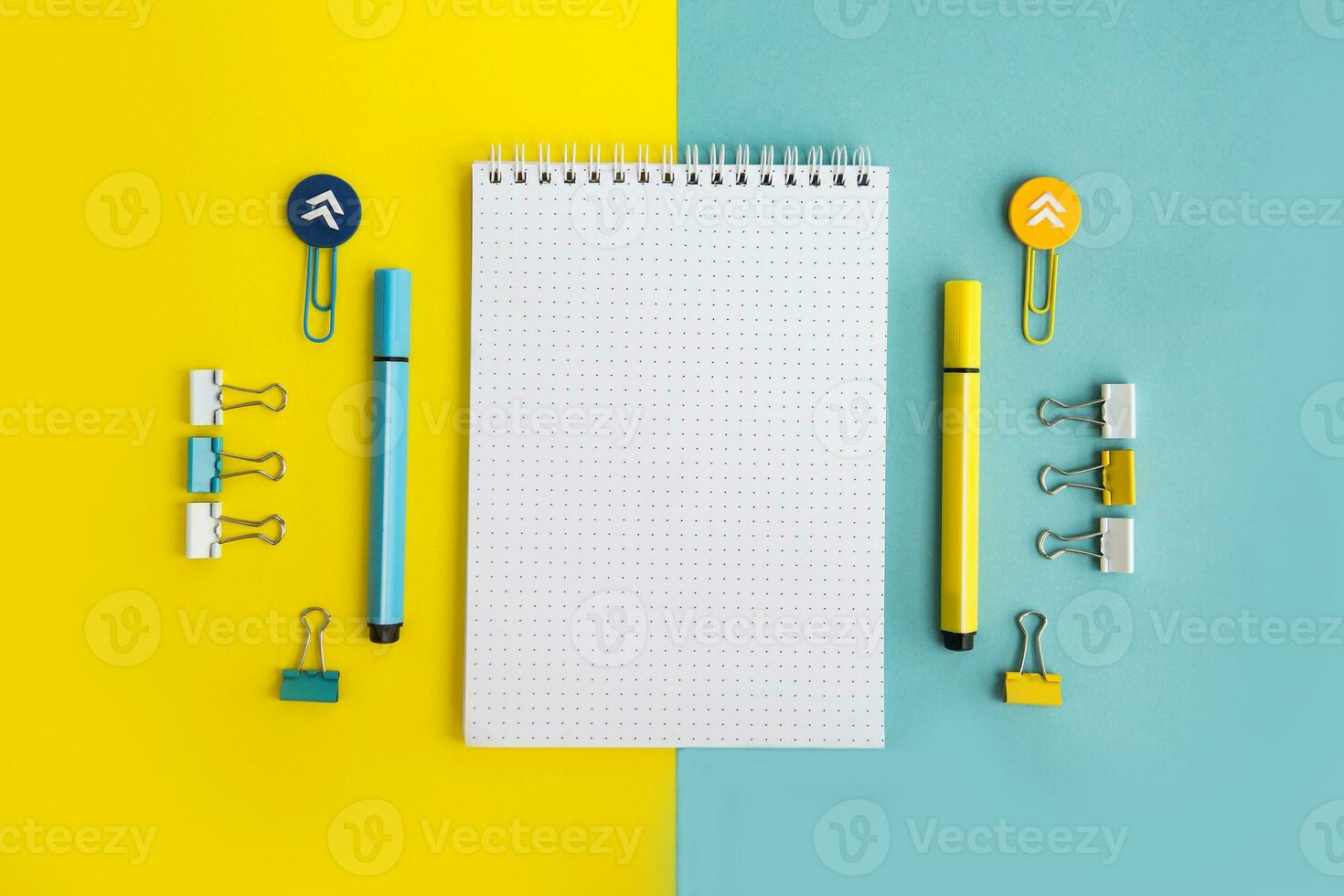 School supplies. Yellow and blue colors. Empty notebook. Flat lay composition. Space for text. photo