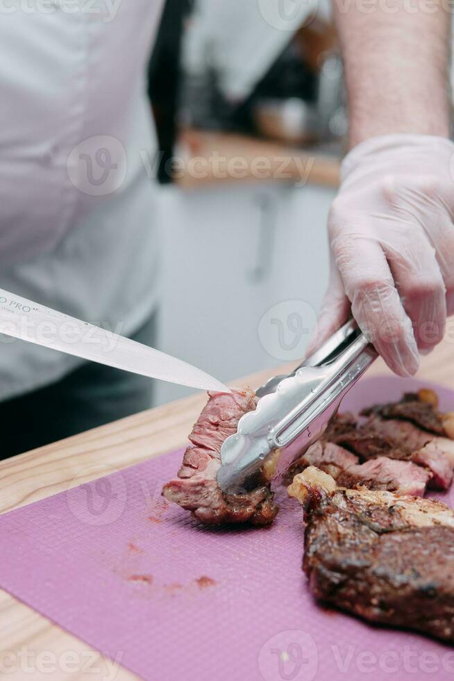 Cooking meat rolls in the cooking class. Beef roll with spices. The process of cutting a roll, close-up. photo