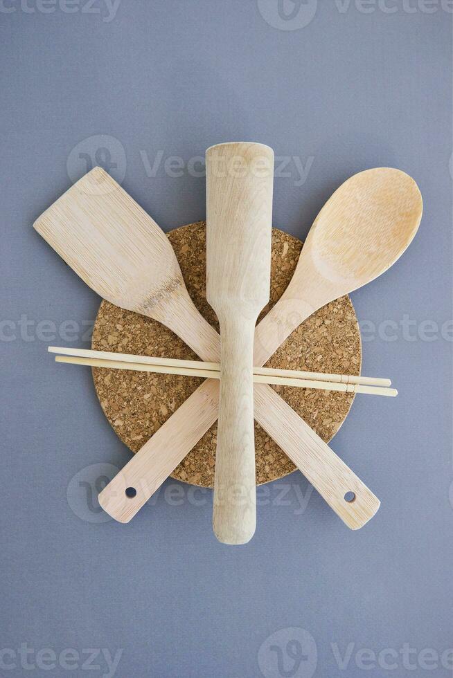 A set of eco-friendly bamboo Cutlery on gray background. Concept of a waste-free lifestyle. Zero waste home. photo