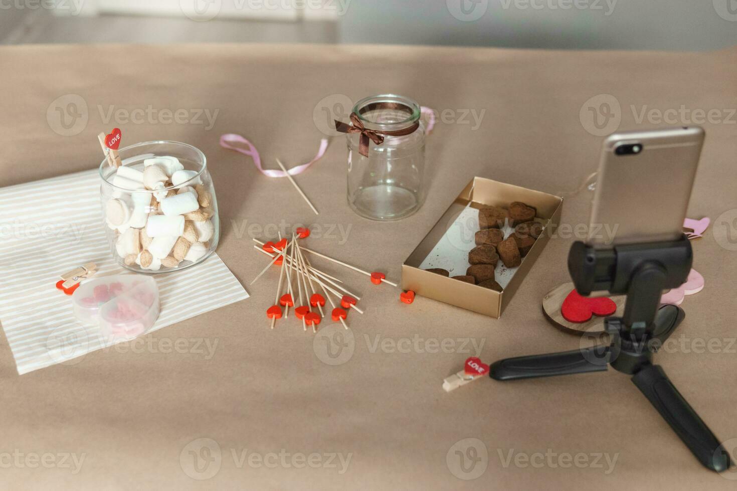 sweet gift for Valentine's Day with your own hands. A gift for the holiday made of heart-shaped candies and marshmallows photo