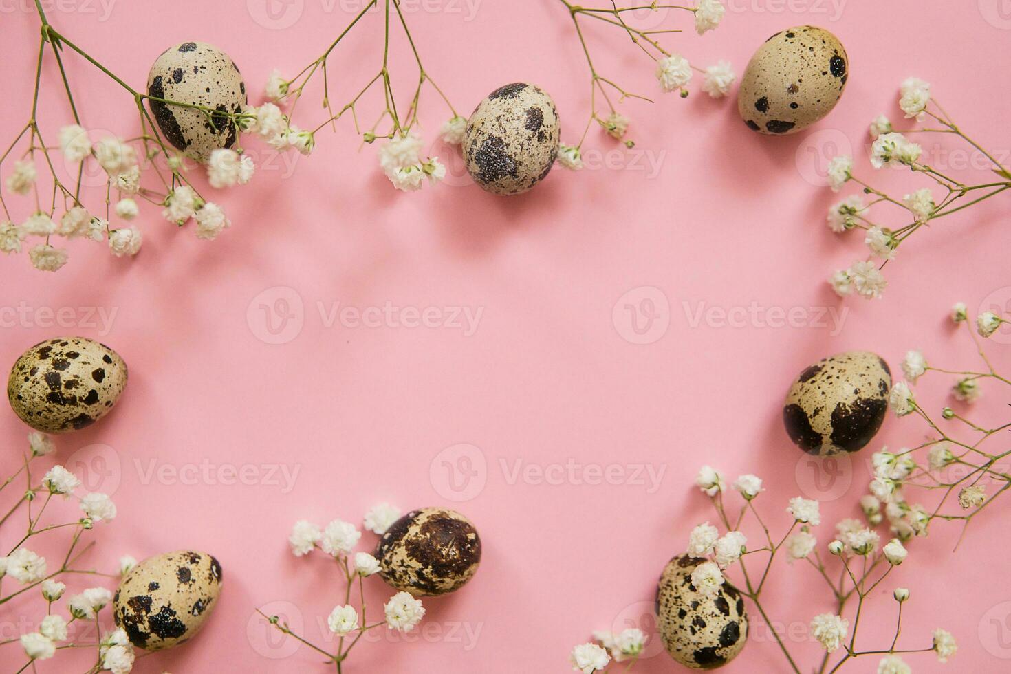 Easter background, quail eggs on a pink background, decorated with natural botanical elements, flat lay, view from above, empty space for text photo