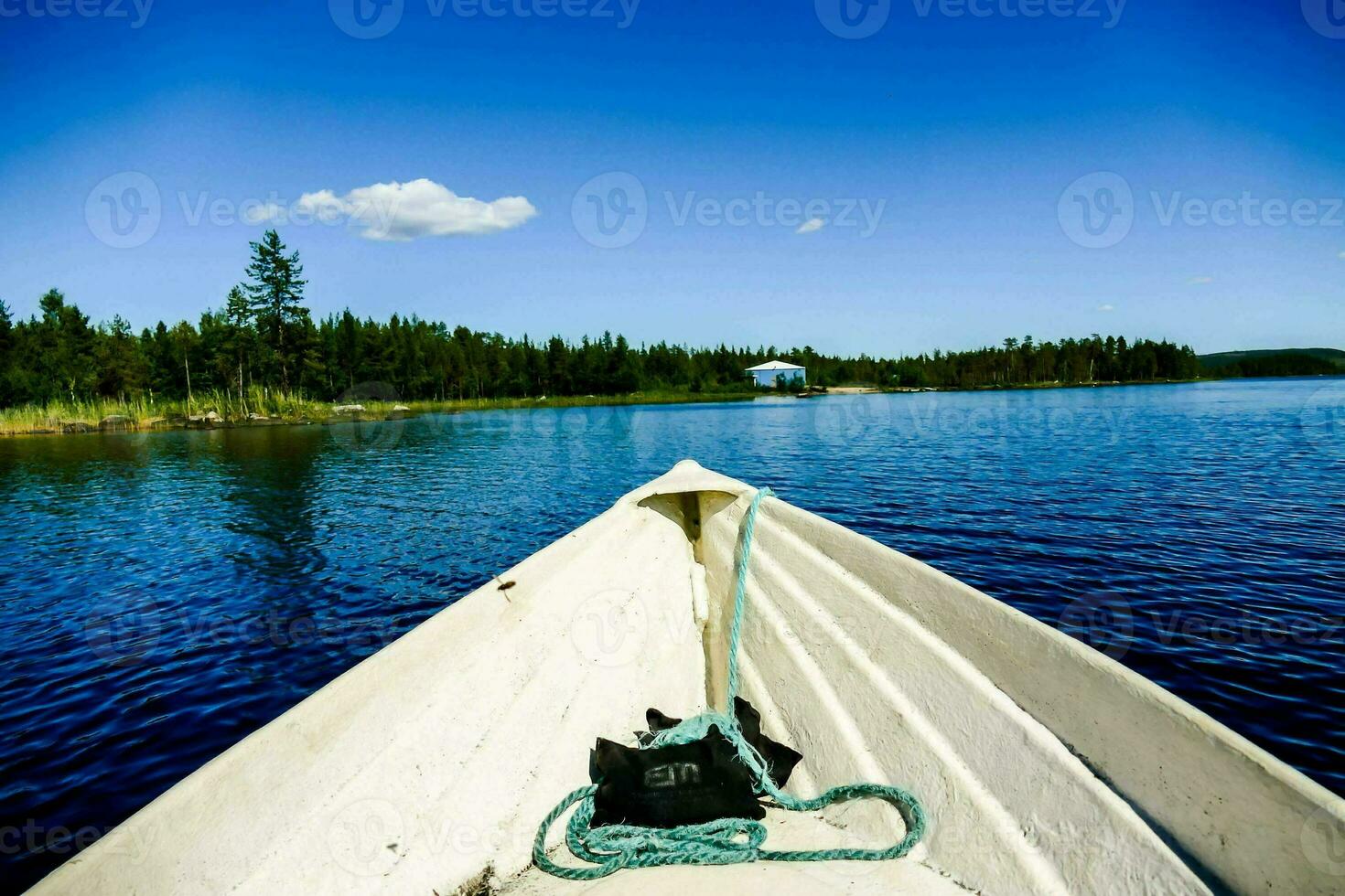 a canoe on the lake with a rope tied to it photo