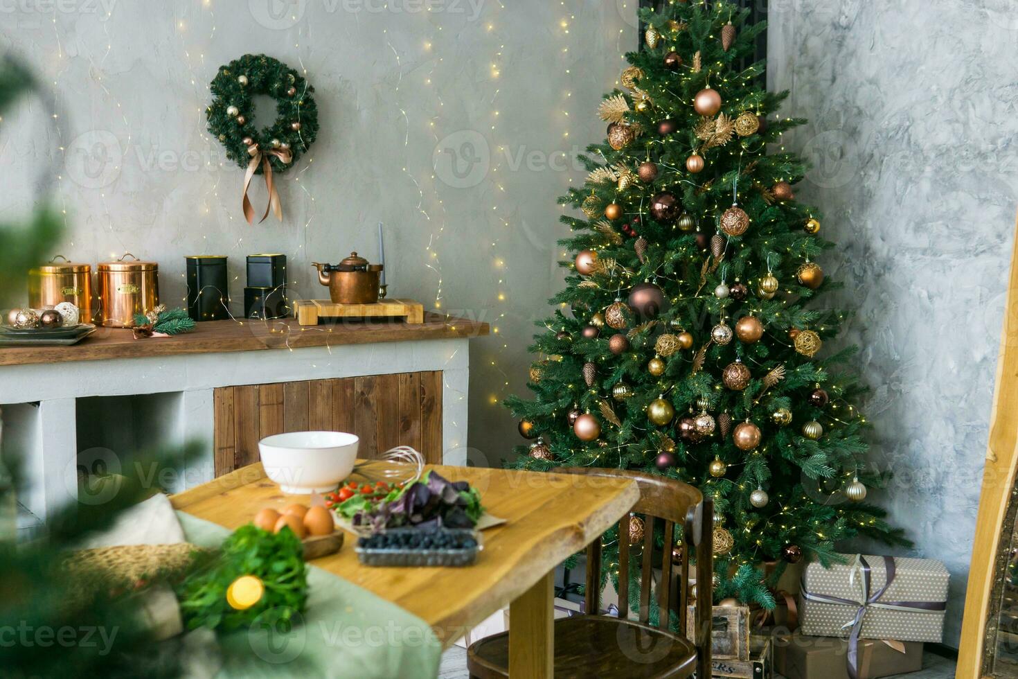 Home New Year's interior. Christmas tree with gifts, decorated with garlands in the kitchen. Cozy atmosphere of a home holiday, loft design of the room, Scandinavian style. photo