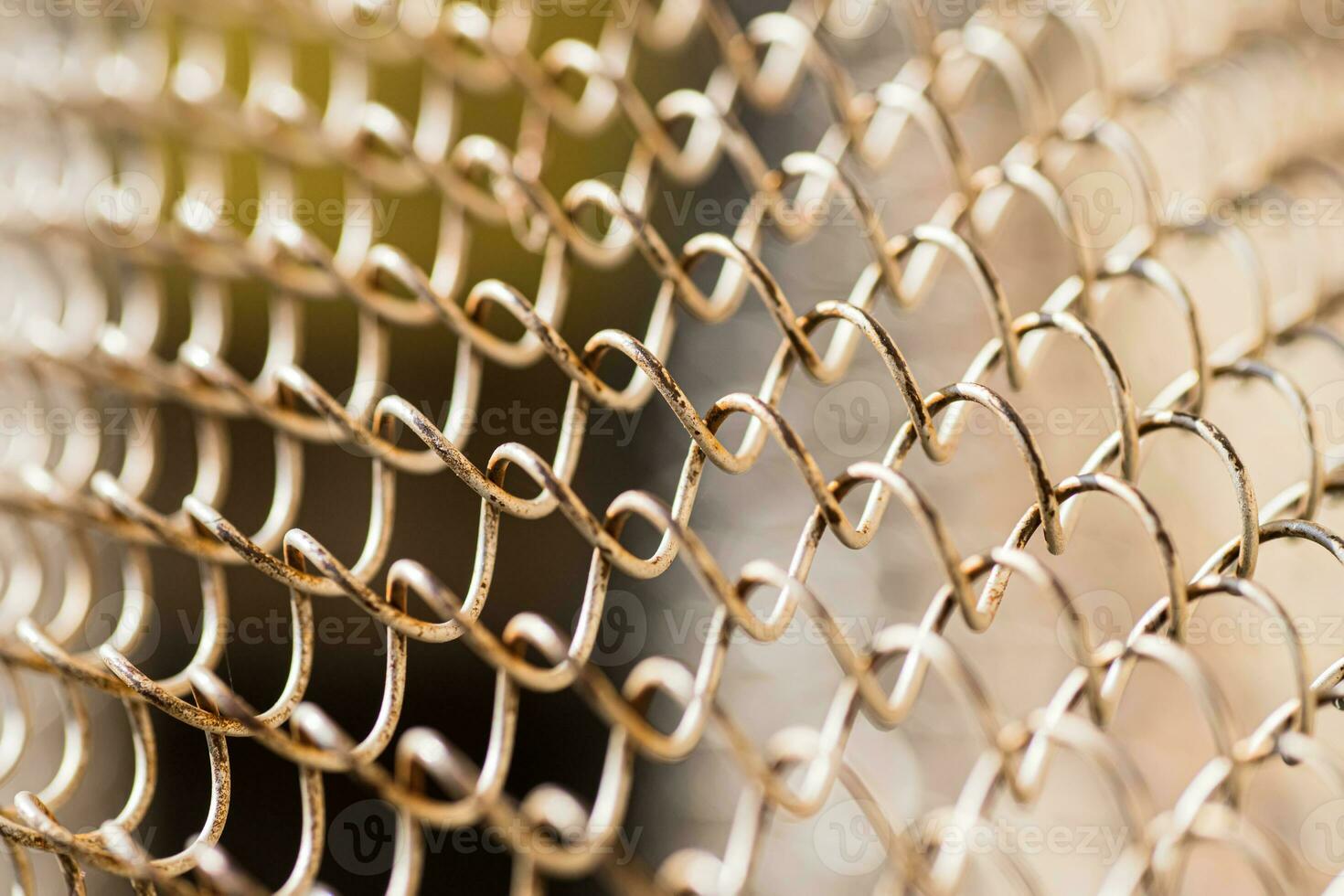Mesh rabitz , texture of weaving mesh network link. Close up of a fence. barrier on way. metal grid close-up. rusty mesh texture photo
