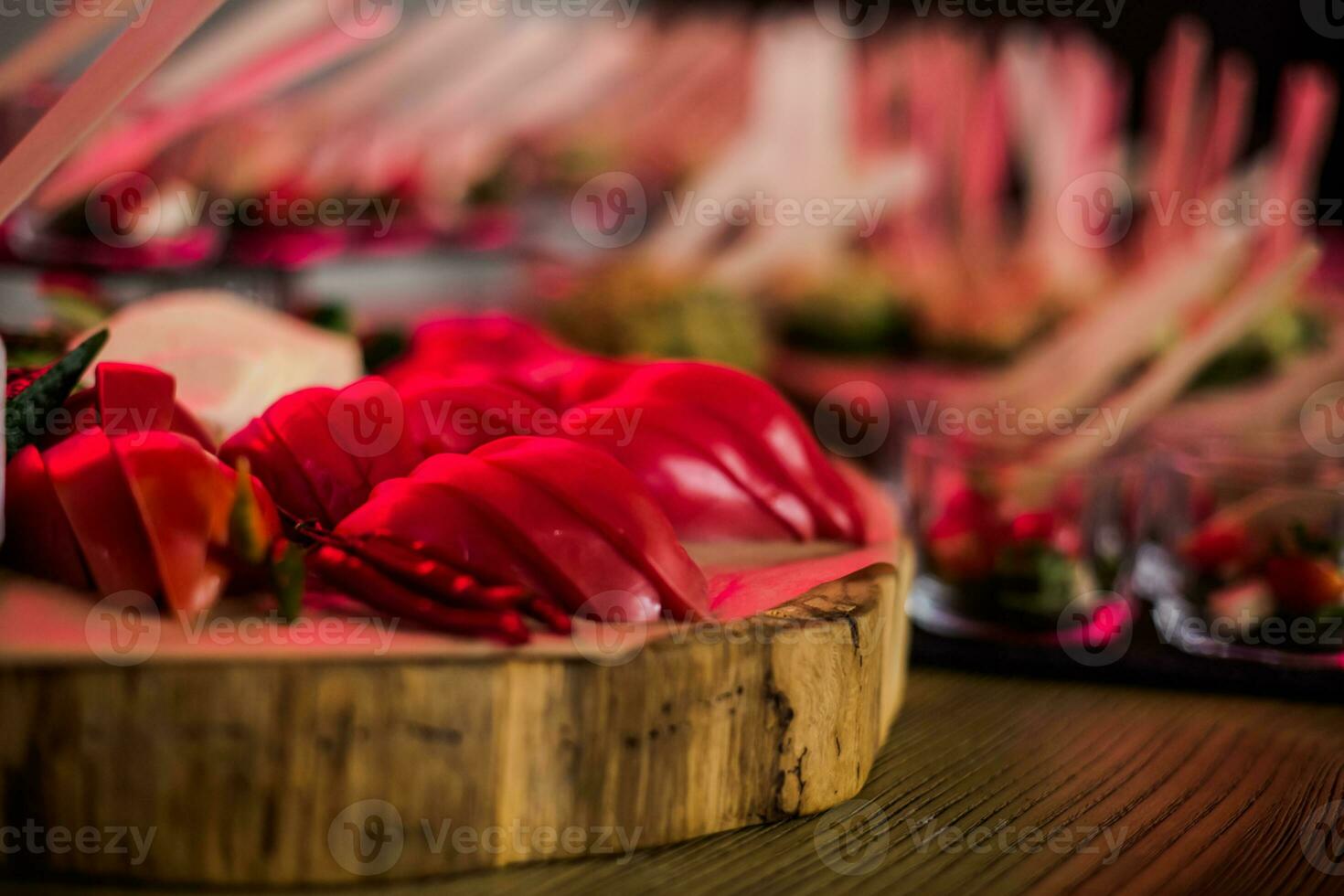 Tomato sliced into thin half rings. Vegetable mix. Snack under the drink. photo