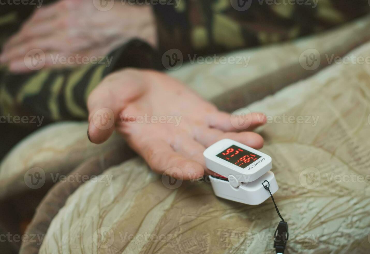 Reduced oxygenation is an emergency sign of pneumonia, for instance caused by coronavirus of elderly man . Concept of detection of asymptomatic coronavirus. photo