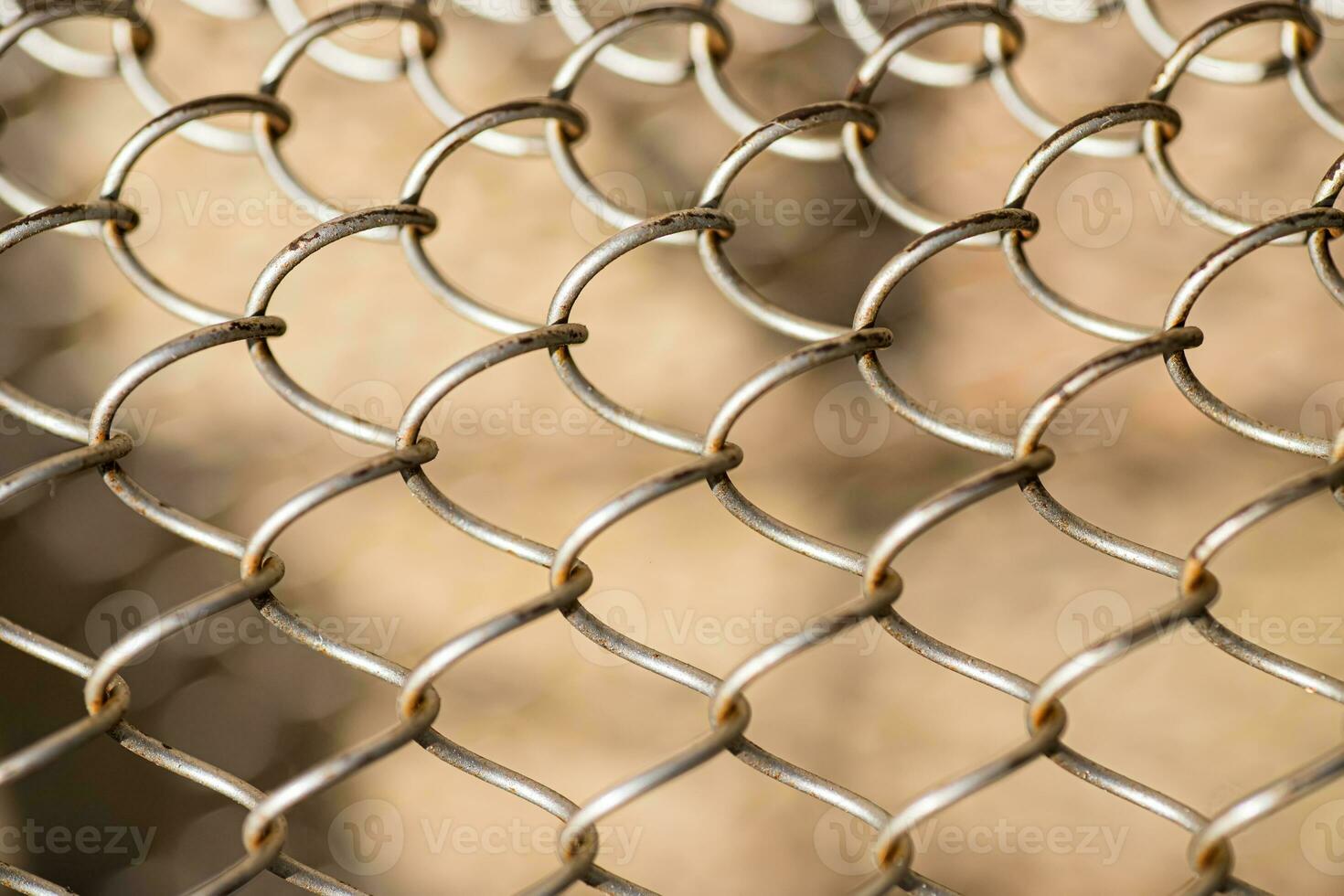 Mesh rabitz , texture of weaving mesh network link. Close up of a fence. barrier on way. metal grid close-up. rusty mesh texture photo