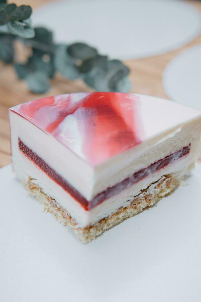 A slice of mousse cake in the cut. Making a cake at a culinary master class. Cooking at home, homemade food photo