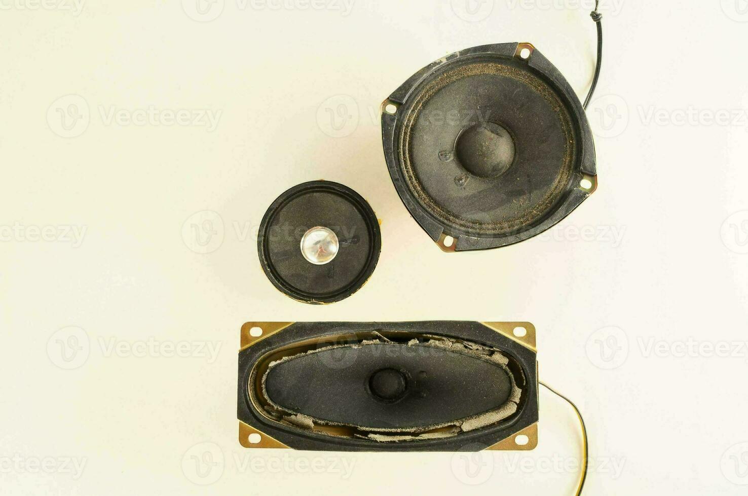 two speakers are shown on a white surface photo
