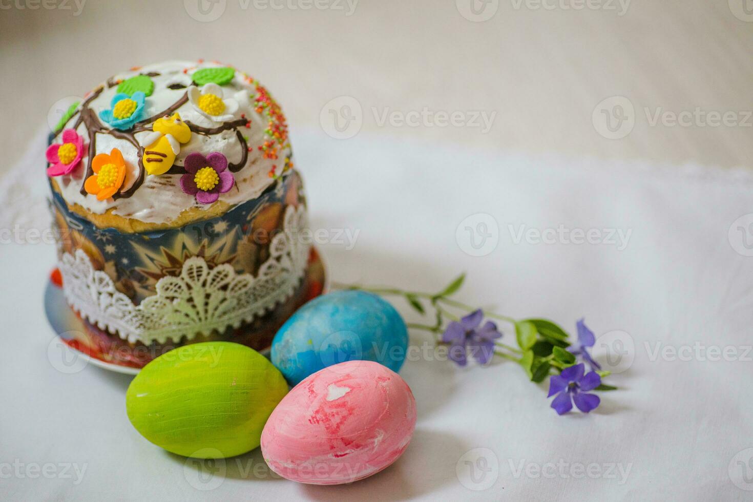 Easter cake with eggs and a flower vinca. Easter background. Self-baked Easter cake. Orthodox Traditions and Holidays photo