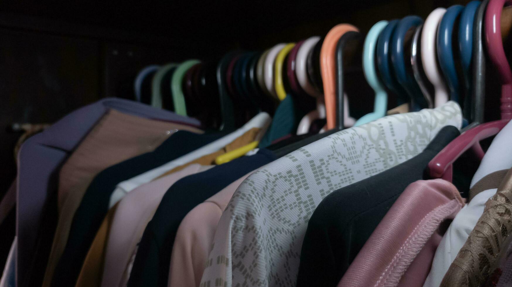 clothes hanging in the wardrobe. selective focus. photo