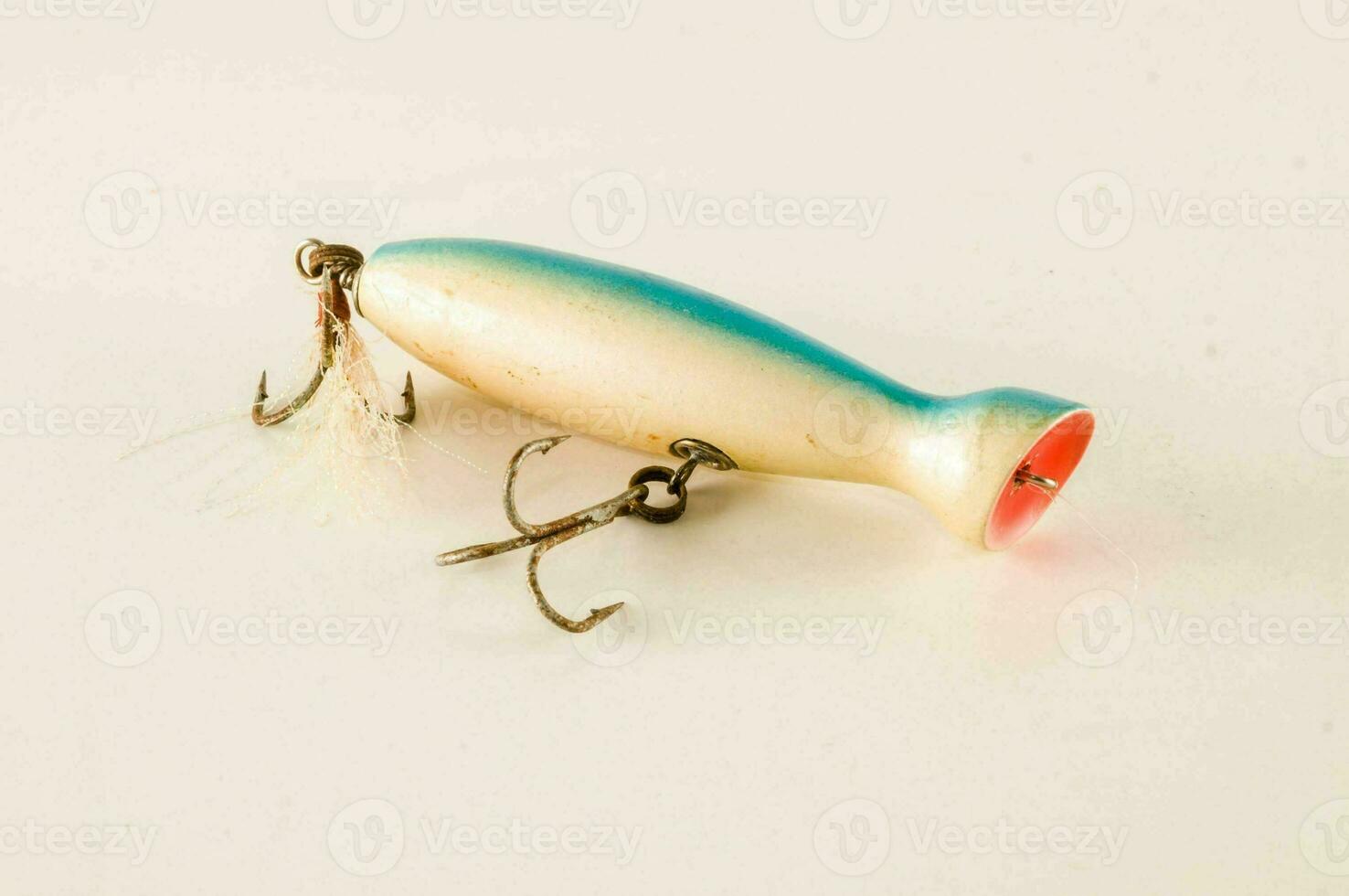 a small fishing lure with a hook on it photo