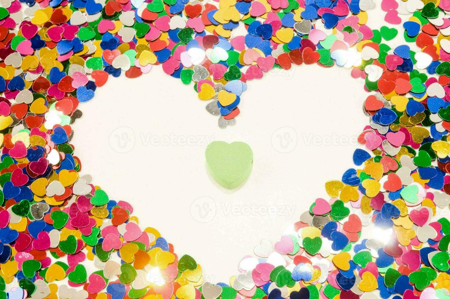 heart shaped confetti on a white background photo