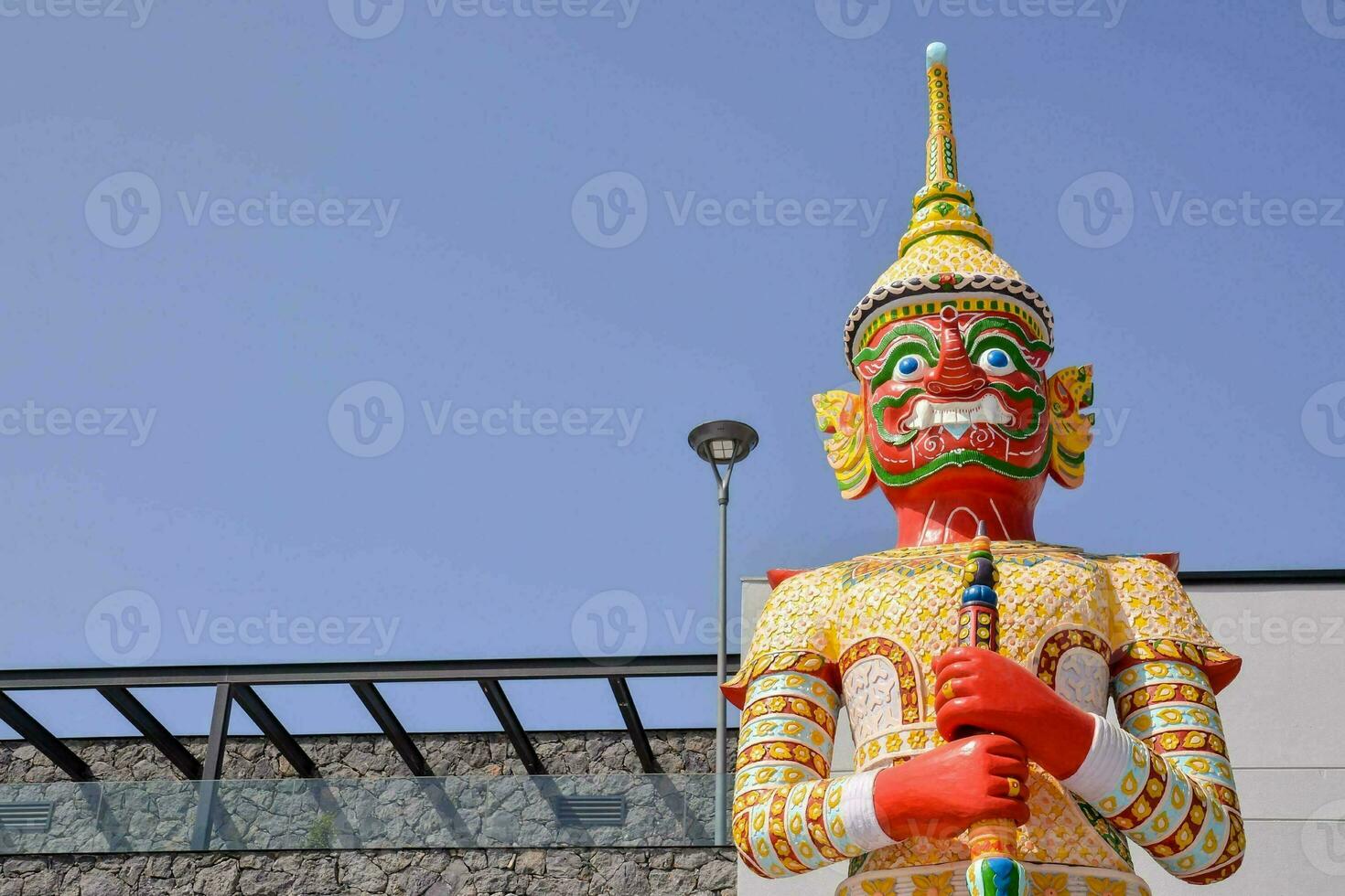 a large statue of a man with a sword photo
