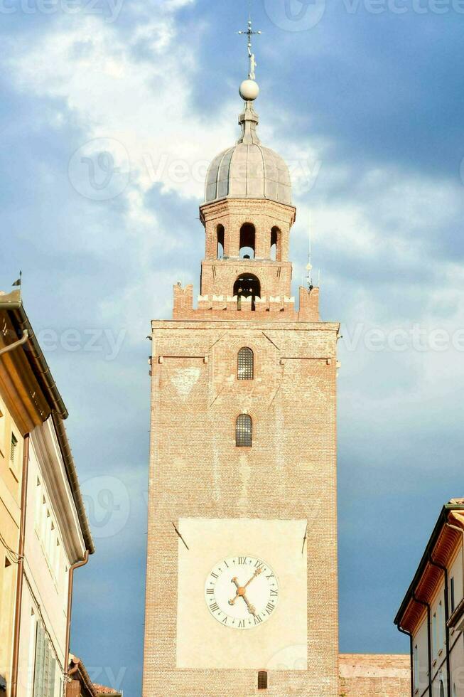 a clock tower in the center of a town photo