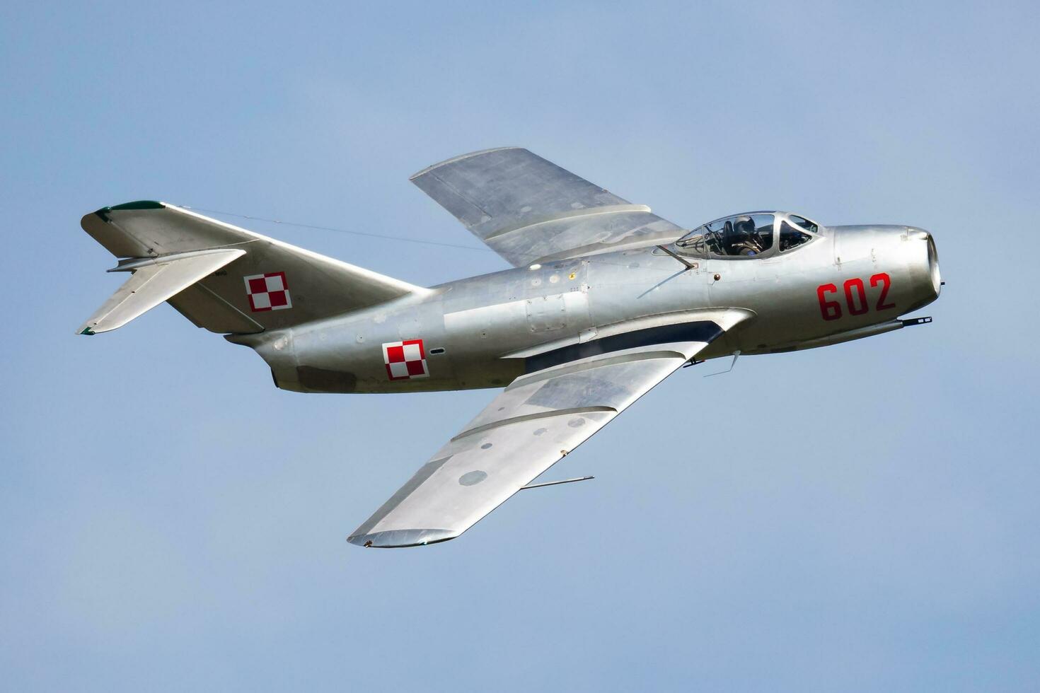 Mig-15 old timer warbird at air base and airfield. Cold war and World War aviation. Airshow display. Aged military warplane aircraft. Fly and flying. photo