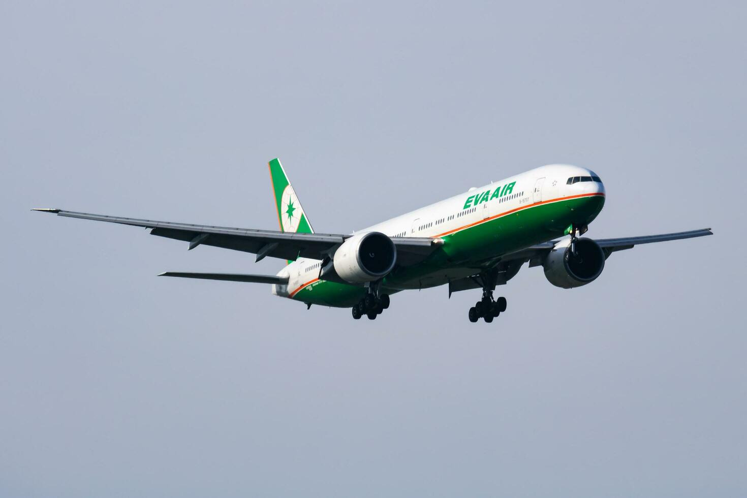 EVA Air Boeing 777-300ER B-16707 passenger plane arrival and landing at Vienna Airport photo