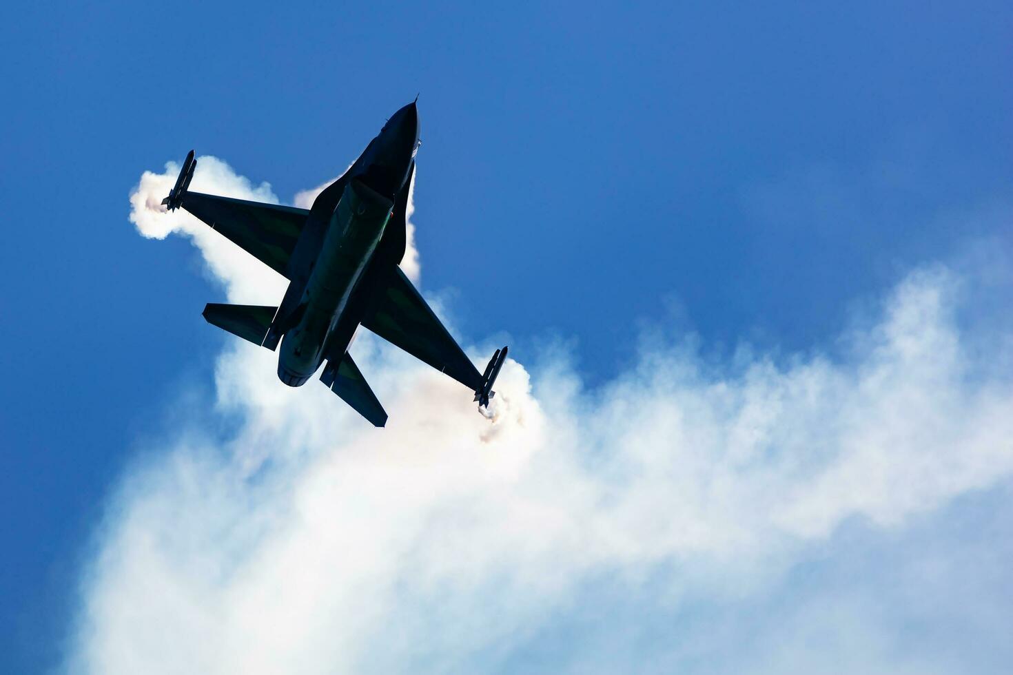 Belgian Air Force Lockheed F-16 Fighting Falcon fighter jet plane flying. Aviation and military aircraft. photo