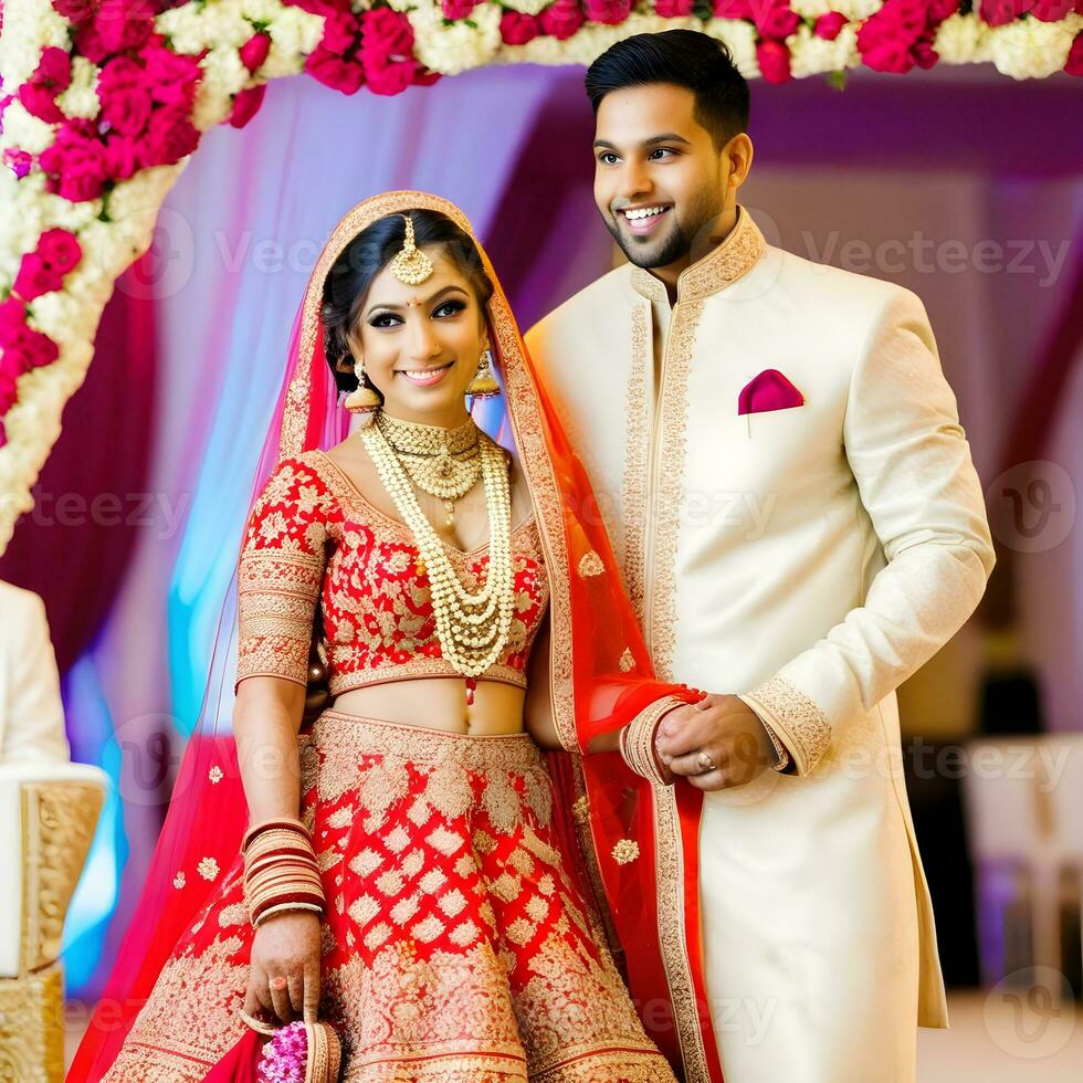 AI generated Indian groom dressed in white Sherwani and red hat with stunning bride in red lehenga stand and hold each hands walking outside photo