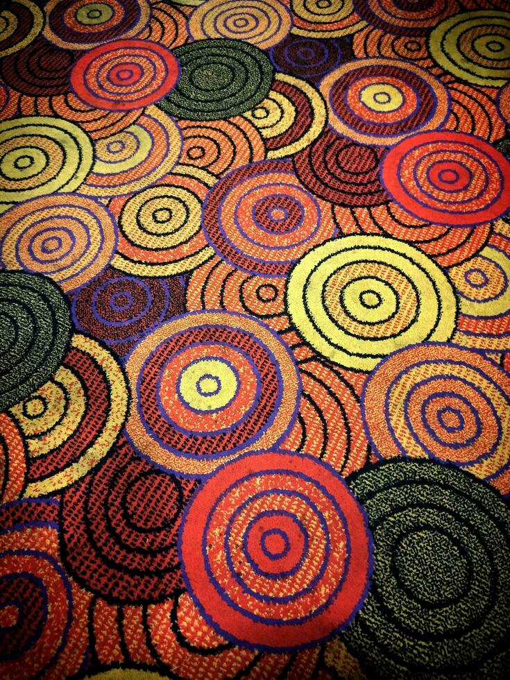 Colorful circle drawing pattern on carpet photo