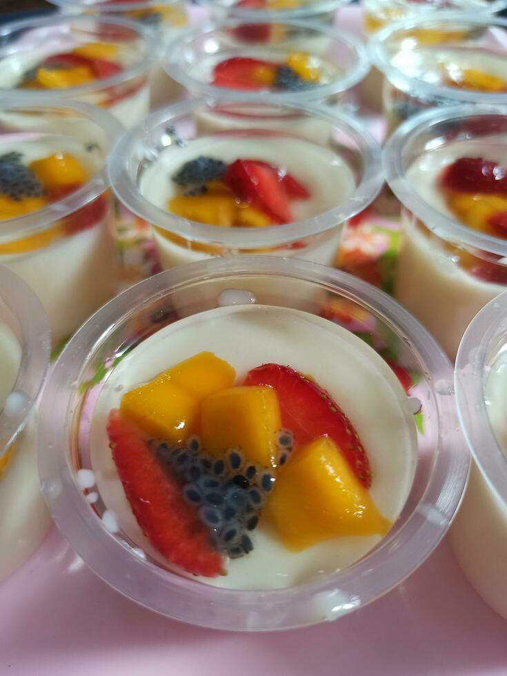 Milk pudding with fruit topping photo