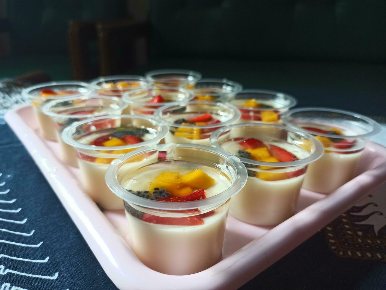 Milk pudding with fruit topping photo