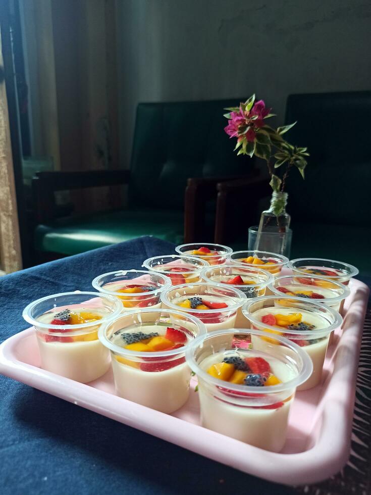 Milk pudding with fruit topping photo