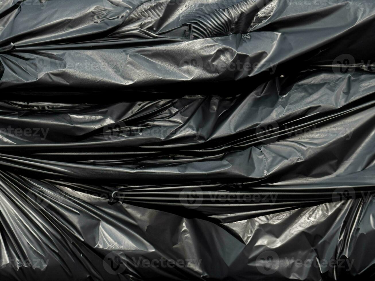 black crumpled black plastic bag photo