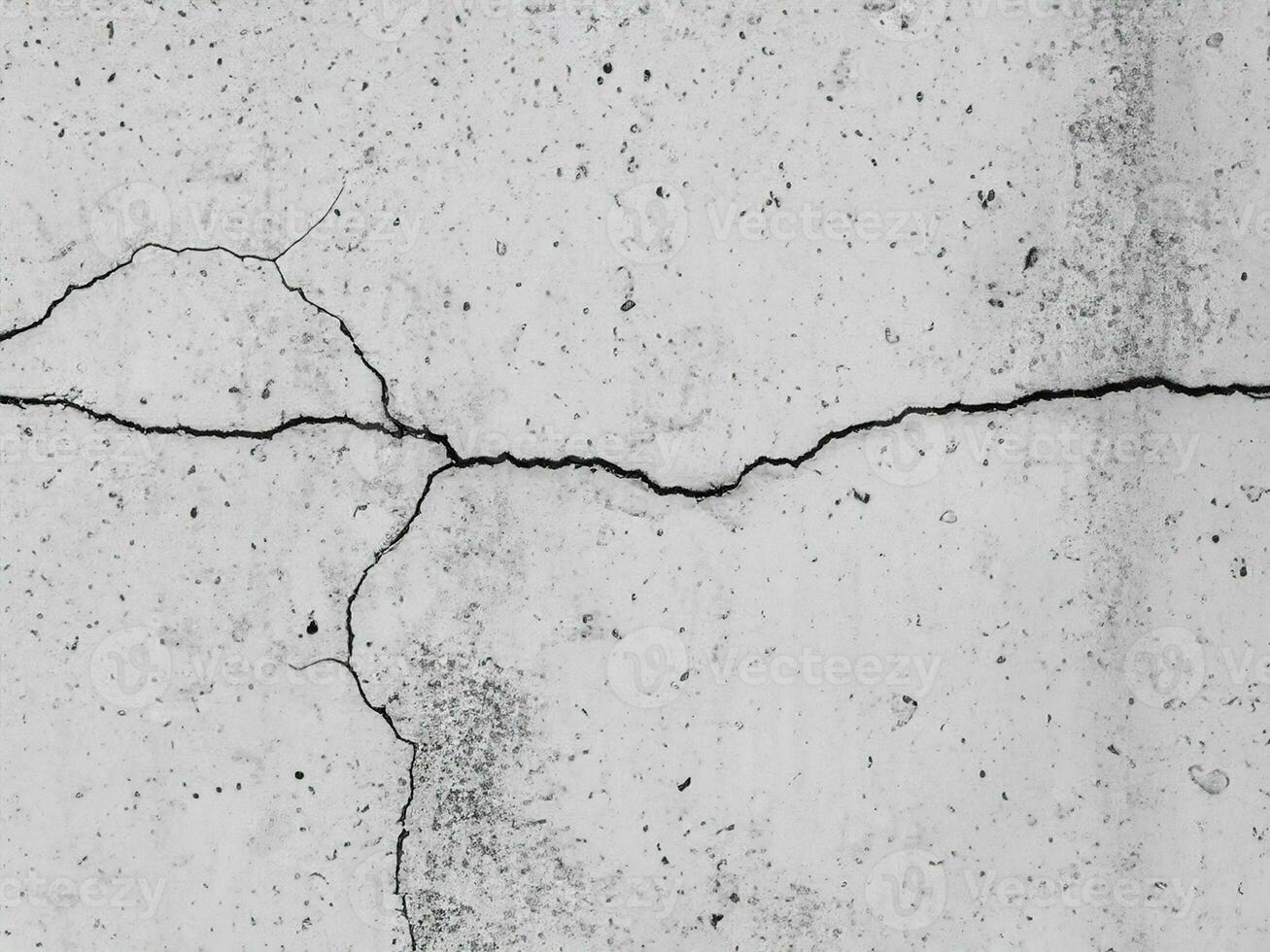close up cracked concrete wall background photo