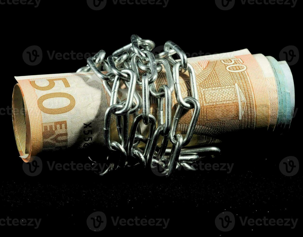 a roll of money wrapped in chains photo