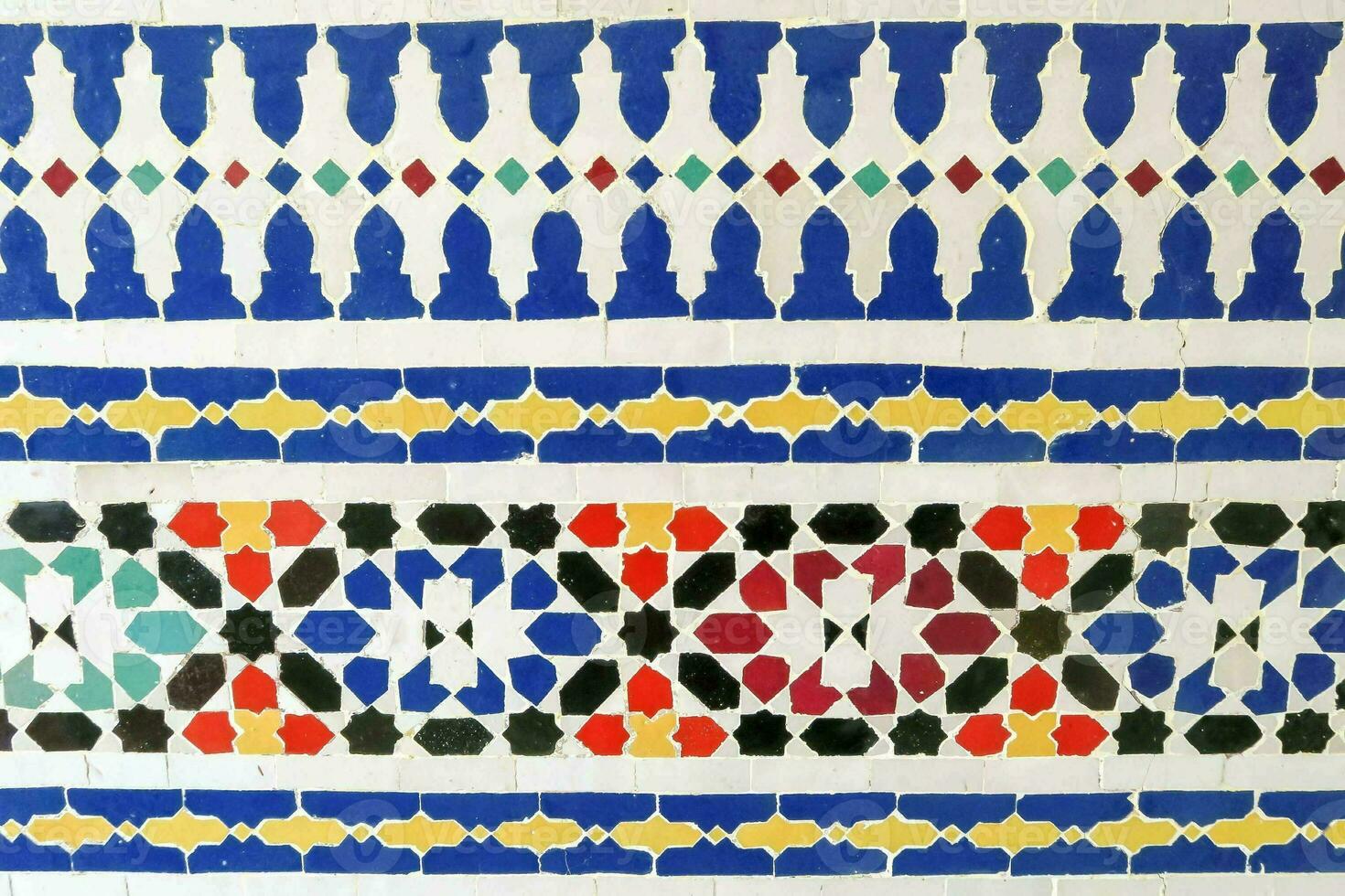 a colorful pattern of tiles with geometric designs photo