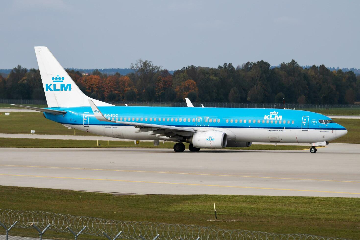 KLM passenger plane at airport. Schedule flight travel. Aviation and aircraft. Air transport. Global international transportation. Fly and flying. photo