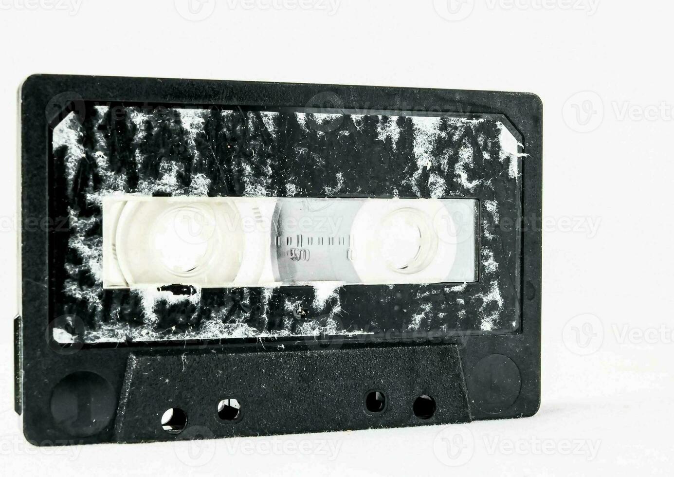 an old cassette is shown on a white surface photo