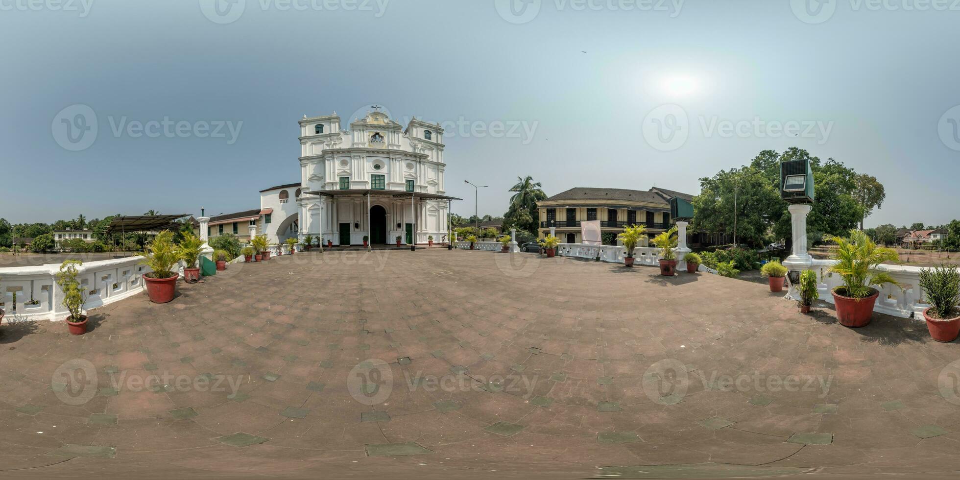 full hdri 360 panorama of portugese catholic church in jungle among palm trees in Indian tropic village in equirectangular projection with zenith and nadir. VR AR content photo