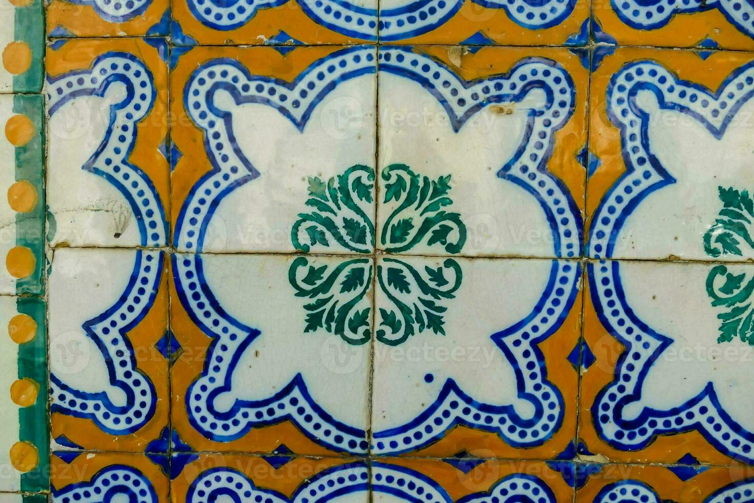 a close up of a colorful tile wall photo