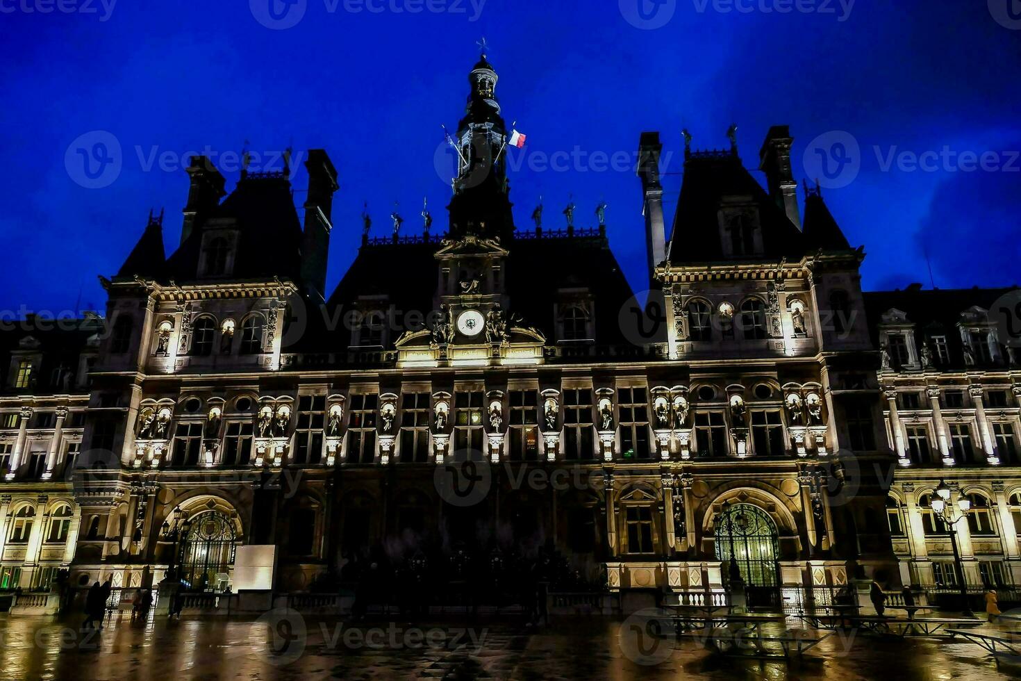 the paris city hall lit up at night photo