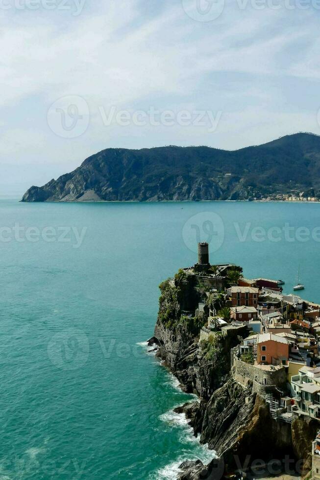 the coast of italy with a small town on top of it photo