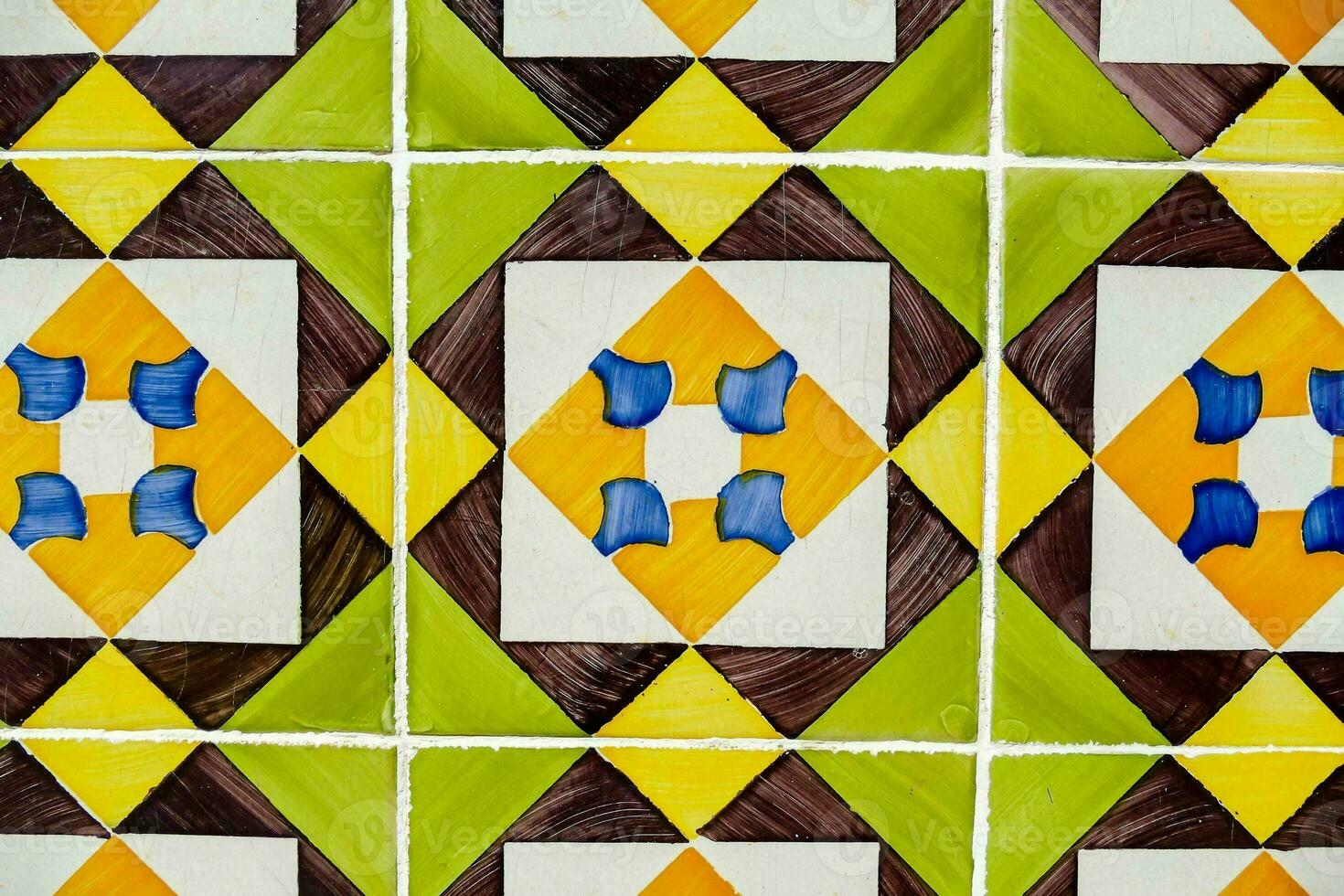 a colorful tile pattern with yellow, green and blue squares photo