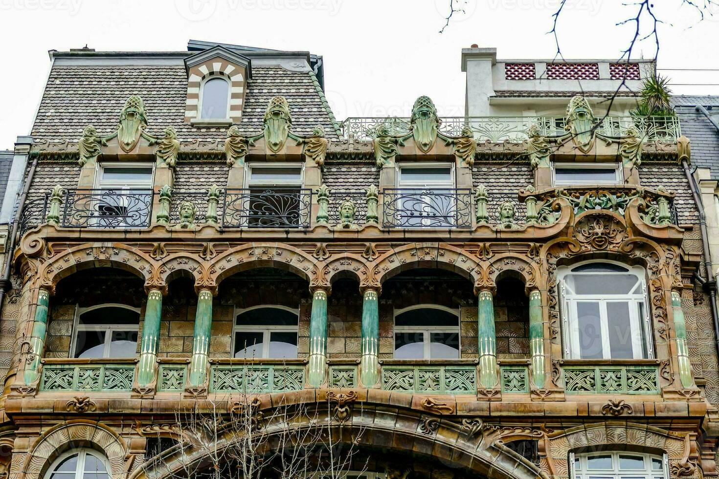 the building has ornate balconies and windows photo