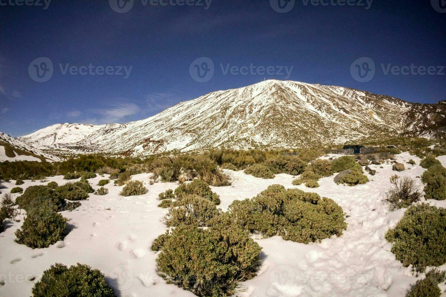 a view of the snow covered mountains photo