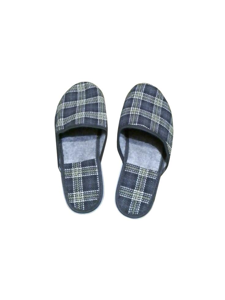 Homemade striped gray slippers on a white background photo