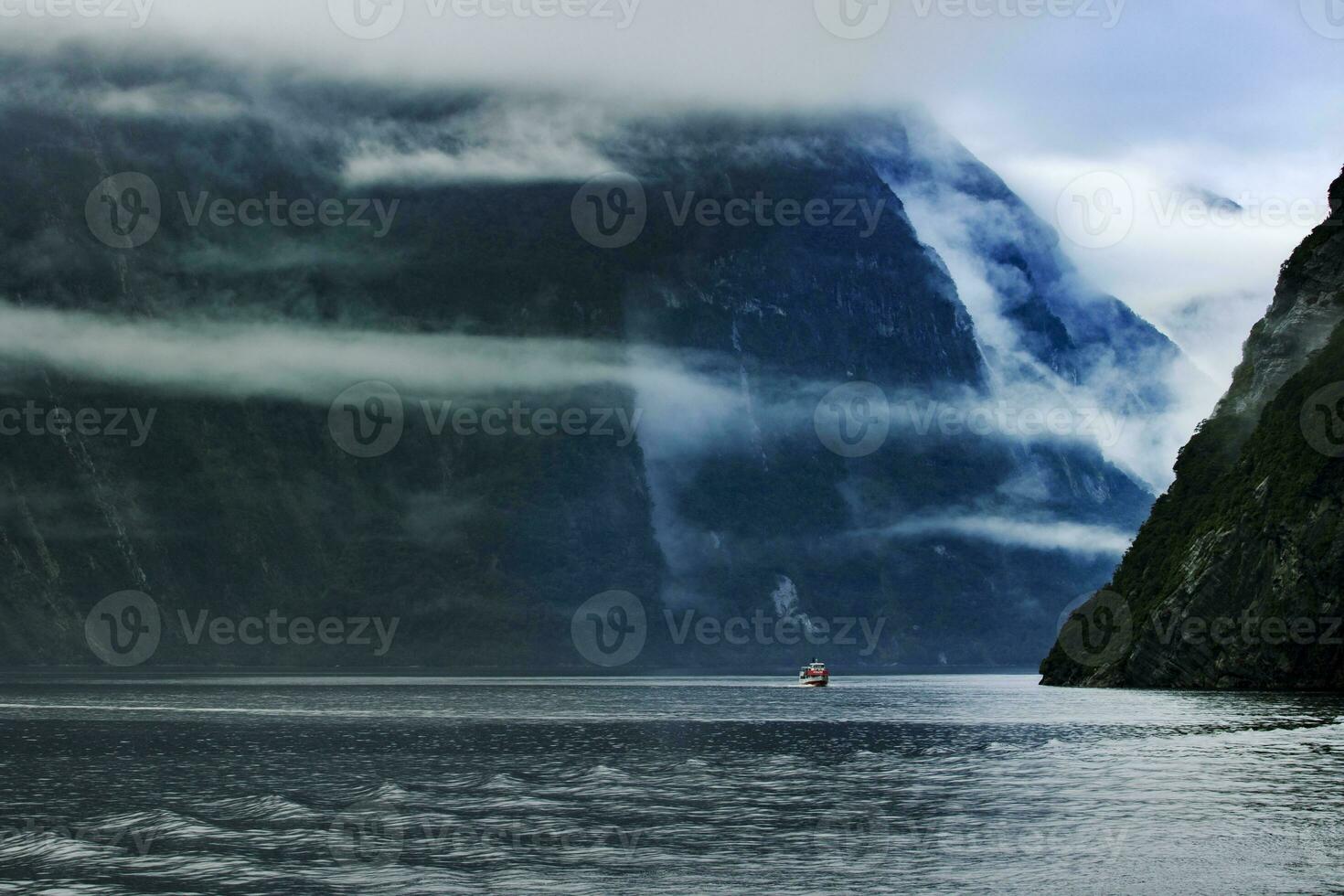 tourist boat cruising in milford sound fjordland national park southland new zealand photo