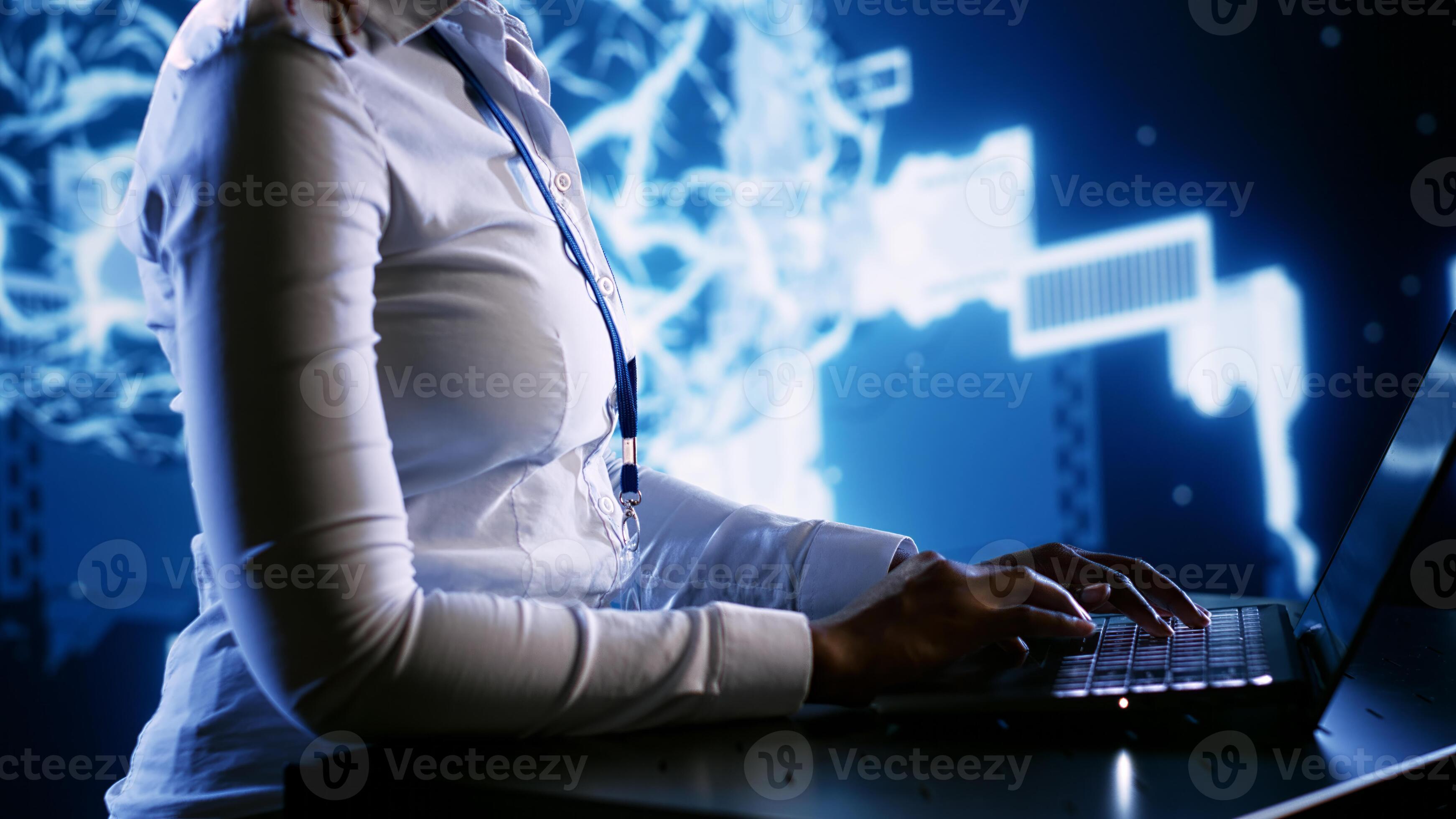 Tech support employee writing artificial intelligence script code in