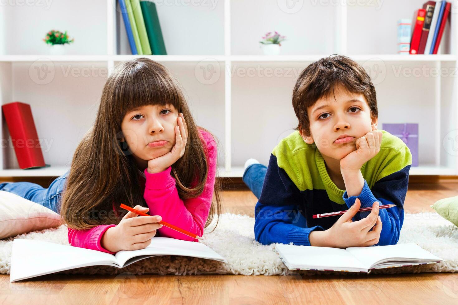 Two children do not want to do homework photo