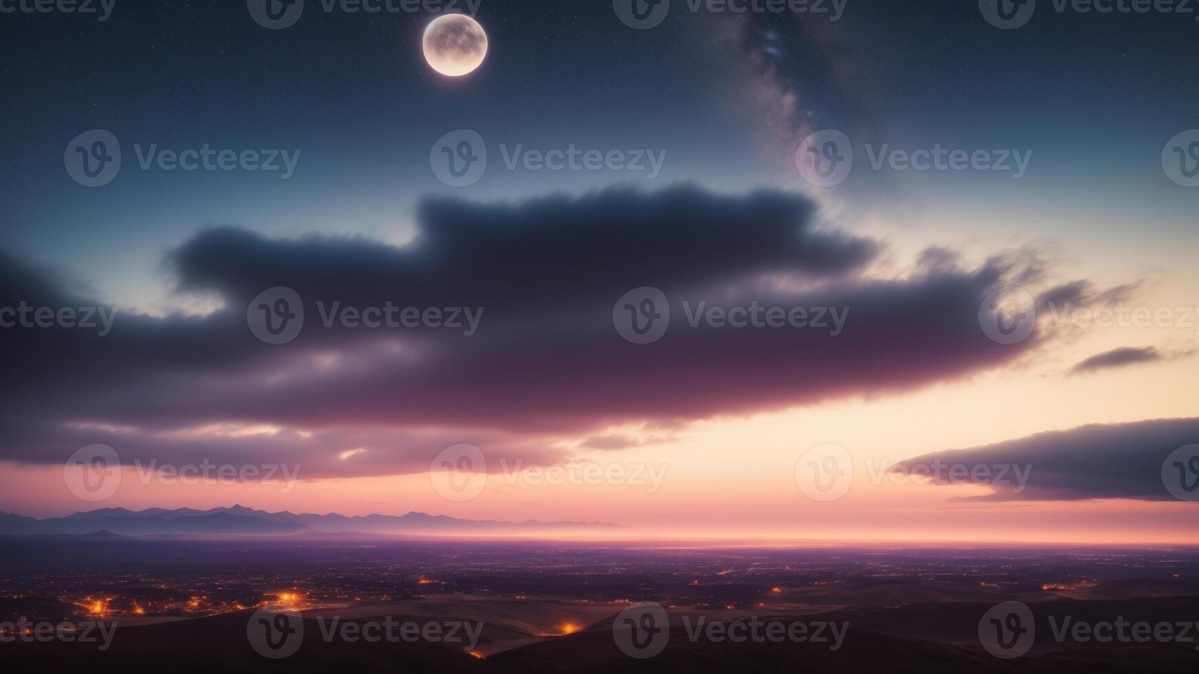 The moon and the clouds over a valley photo
