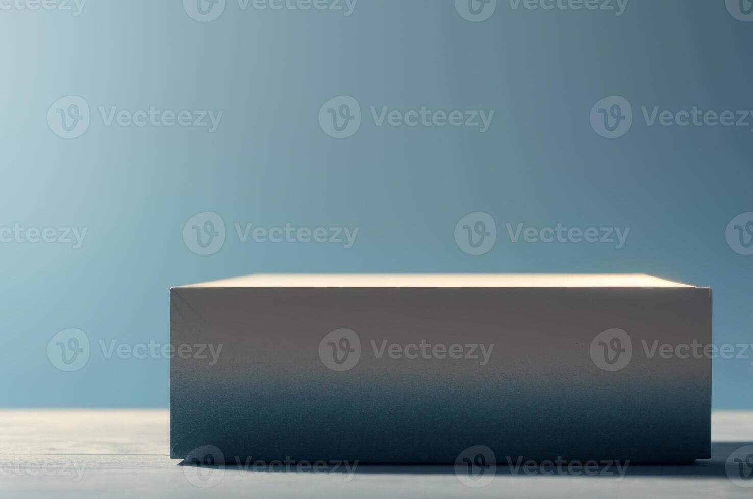 A white box sitting on a table with a blue background photo