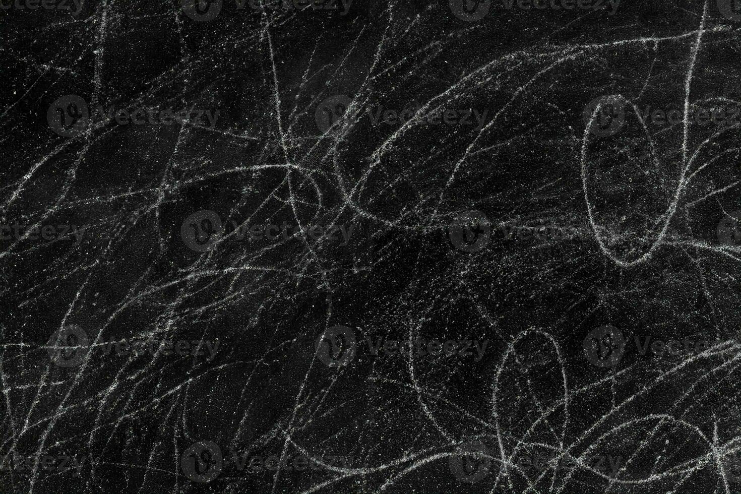 White scratches on rough black concrete wall surface for texture background photo