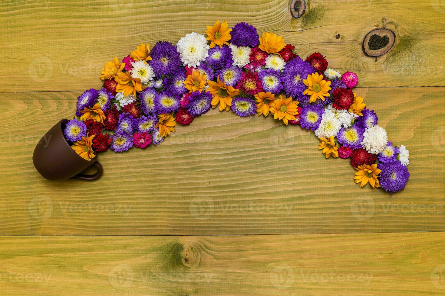 Image of beautiful flowers and coffee or tea cup on wooden background. photo