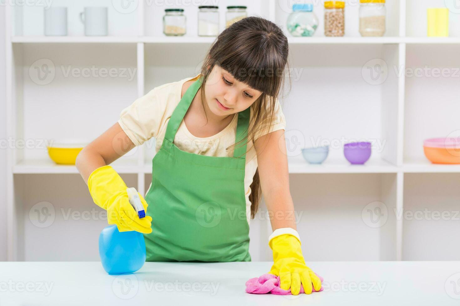 Happy little girl enjoys cleaning photo