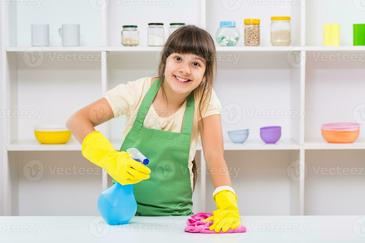 Happy little girl enjoys cleaning photo